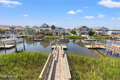 Charming Beach Cottage on Canal Lot with Boat Dock This is a on Sea Trail Golf Resort in North Carolina - for sale on GolfHomes.com, golf home, golf lot