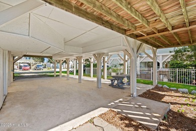 Charming Beach Cottage on Canal Lot with Boat Dock This is a on Sea Trail Golf Resort in North Carolina - for sale on GolfHomes.com, golf home, golf lot