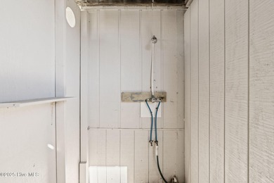 Charming Beach Cottage on Canal Lot with Boat Dock This is a on Sea Trail Golf Resort in North Carolina - for sale on GolfHomes.com, golf home, golf lot