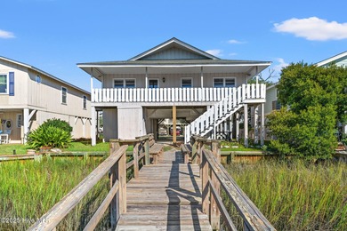 Charming Beach Cottage on Canal Lot with Boat Dock This is a on Sea Trail Golf Resort in North Carolina - for sale on GolfHomes.com, golf home, golf lot