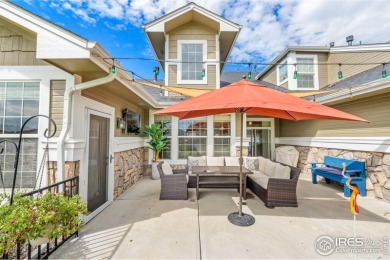 This stunning corner townhome backs to green space and offers a on Pelican Lakes Golf and Country Club in Colorado - for sale on GolfHomes.com, golf home, golf lot