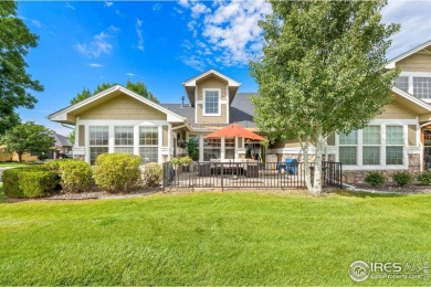This stunning corner townhome backs to green space and offers a on Pelican Lakes Golf and Country Club in Colorado - for sale on GolfHomes.com, golf home, golf lot