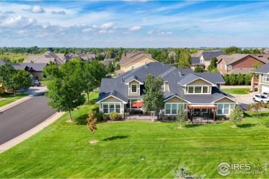 This stunning corner townhome backs to green space and offers a on Pelican Lakes Golf and Country Club in Colorado - for sale on GolfHomes.com, golf home, golf lot