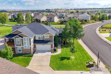 This stunning corner townhome backs to green space and offers a on Pelican Lakes Golf and Country Club in Colorado - for sale on GolfHomes.com, golf home, golf lot