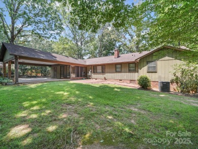 Welcome to this 1970s ranch-style home located in the desirable on Pine Island Country Club in North Carolina - for sale on GolfHomes.com, golf home, golf lot