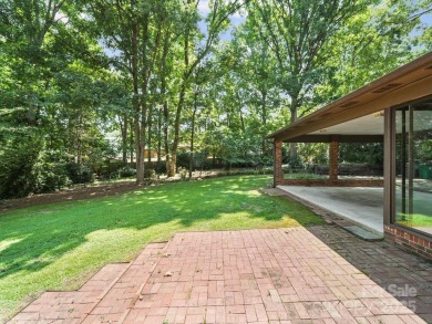 Welcome to this 1970s ranch-style home located in the desirable on Pine Island Country Club in North Carolina - for sale on GolfHomes.com, golf home, golf lot