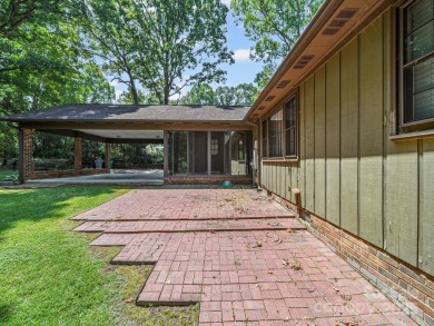 Welcome to this 1970s ranch-style home located in the desirable on Pine Island Country Club in North Carolina - for sale on GolfHomes.com, golf home, golf lot