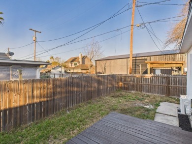 Updated home with large living spaces and a huge covered porch on Rockport Country Club in Texas - for sale on GolfHomes.com, golf home, golf lot