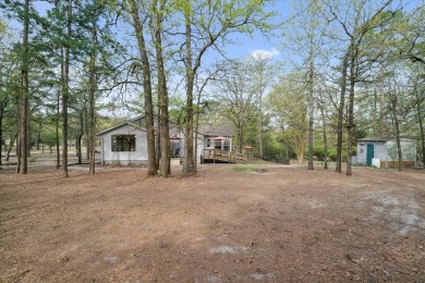 Beautifully maintained home in gated community. The cute covered on Holly Lake Ranch Golf Club in Texas - for sale on GolfHomes.com, golf home, golf lot