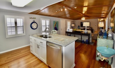 This charming 2-bedroom, 1-bathroom mobile home offers the on Barefoot Resort and Golf Club  in South Carolina - for sale on GolfHomes.com, golf home, golf lot