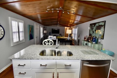 This charming 2-bedroom, 1-bathroom mobile home offers the on Barefoot Resort and Golf Club  in South Carolina - for sale on GolfHomes.com, golf home, golf lot