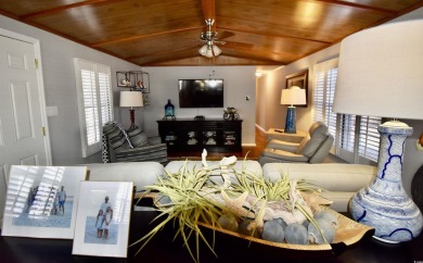This charming 2-bedroom, 1-bathroom mobile home offers the on Barefoot Resort and Golf Club  in South Carolina - for sale on GolfHomes.com, golf home, golf lot