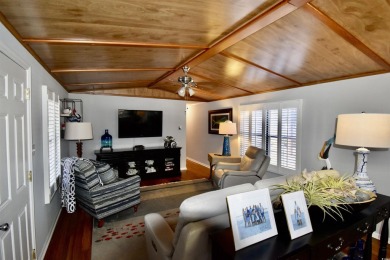 This charming 2-bedroom, 1-bathroom mobile home offers the on Barefoot Resort and Golf Club  in South Carolina - for sale on GolfHomes.com, golf home, golf lot