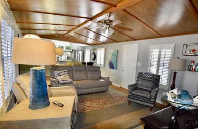 This charming 2-bedroom, 1-bathroom mobile home offers the on Barefoot Resort and Golf Club  in South Carolina - for sale on GolfHomes.com, golf home, golf lot