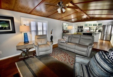 This charming 2-bedroom, 1-bathroom mobile home offers the on Barefoot Resort and Golf Club  in South Carolina - for sale on GolfHomes.com, golf home, golf lot