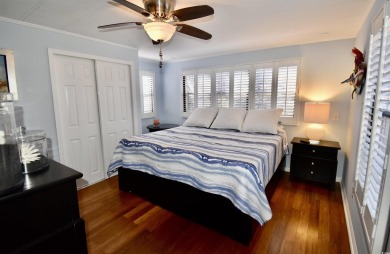 This charming 2-bedroom, 1-bathroom mobile home offers the on Barefoot Resort and Golf Club  in South Carolina - for sale on GolfHomes.com, golf home, golf lot