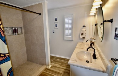 This charming 2-bedroom, 1-bathroom mobile home offers the on Barefoot Resort and Golf Club  in South Carolina - for sale on GolfHomes.com, golf home, golf lot