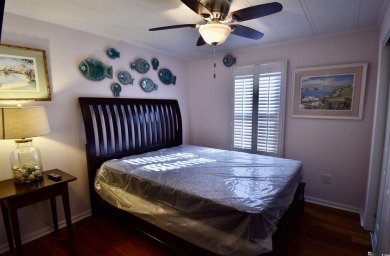 This charming 2-bedroom, 1-bathroom mobile home offers the on Barefoot Resort and Golf Club  in South Carolina - for sale on GolfHomes.com, golf home, golf lot