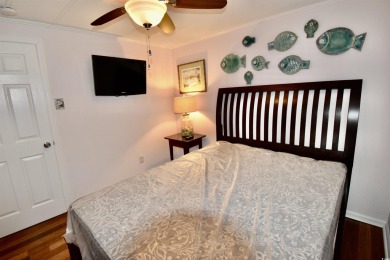 This charming 2-bedroom, 1-bathroom mobile home offers the on Barefoot Resort and Golf Club  in South Carolina - for sale on GolfHomes.com, golf home, golf lot