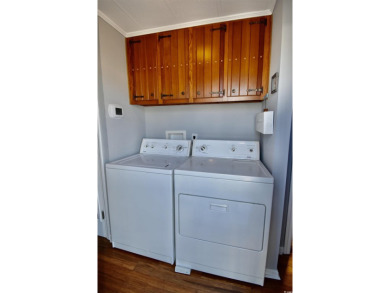 This charming 2-bedroom, 1-bathroom mobile home offers the on Barefoot Resort and Golf Club  in South Carolina - for sale on GolfHomes.com, golf home, golf lot