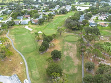 You do not want to miss out on this home in the highly on Highland Lakes Executive Golf Course in Florida - for sale on GolfHomes.com, golf home, golf lot