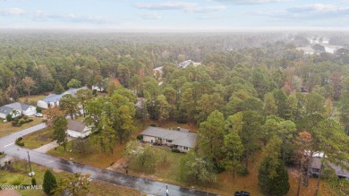 Quaint ranch style 3 bed 3 bathroom brick home on a quiet on Harbour Point Golf Club in North Carolina - for sale on GolfHomes.com, golf home, golf lot