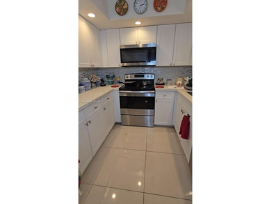 Beautifully maintained 1-bedroom, 1.5-bath condo in the highly on Flamingo Lakes Country Club in Florida - for sale on GolfHomes.com, golf home, golf lot