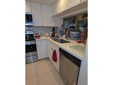 Beautifully maintained 1-bedroom, 1.5-bath condo in the highly on Flamingo Lakes Country Club in Florida - for sale on GolfHomes.com, golf home, golf lot