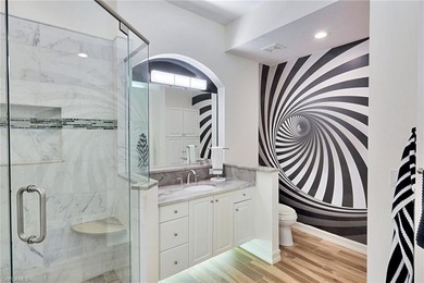 Welcome to effortless living in Palm Colony at Pelican Landing on The Colony Golf and Country Club in Florida - for sale on GolfHomes.com, golf home, golf lot