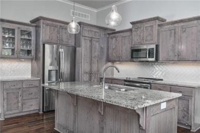 Welcome to comfort and style in this charming 1.5-story reverse on Prairie Highlands Golf Course in Kansas - for sale on GolfHomes.com, golf home, golf lot