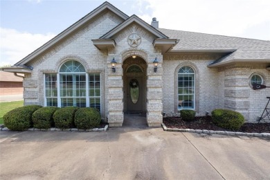 Welcome to this beautifully maintained 4-bedroom, 2-bathroom on Pecan Plantation Country Club in Texas - for sale on GolfHomes.com, golf home, golf lot