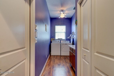 Welcome to your new home! This inviting 3-bedroom, 2-bath home on The Grand Club Cypress Course in Florida - for sale on GolfHomes.com, golf home, golf lot