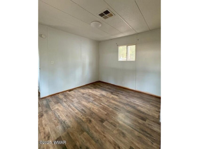 Check out this 2 bedroom, 1 bath home nestled in the tall pines on Bison Golf and Country Club in Arizona - for sale on GolfHomes.com, golf home, golf lot