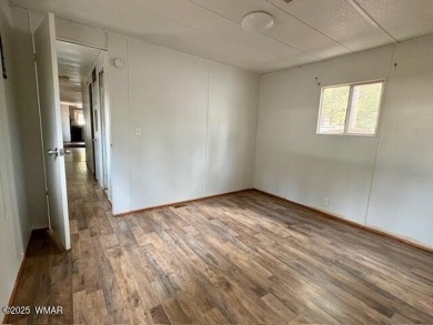 Check out this 2 bedroom, 1 bath home nestled in the tall pines on Bison Golf and Country Club in Arizona - for sale on GolfHomes.com, golf home, golf lot