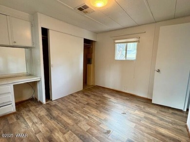 Check out this 2 bedroom, 1 bath home nestled in the tall pines on Bison Golf and Country Club in Arizona - for sale on GolfHomes.com, golf home, golf lot