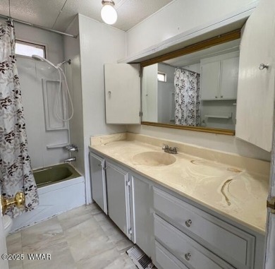 Check out this 2 bedroom, 1 bath home nestled in the tall pines on Bison Golf and Country Club in Arizona - for sale on GolfHomes.com, golf home, golf lot