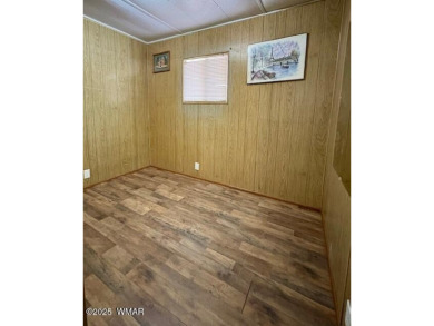 Check out this 2 bedroom, 1 bath home nestled in the tall pines on Bison Golf and Country Club in Arizona - for sale on GolfHomes.com, golf home, golf lot