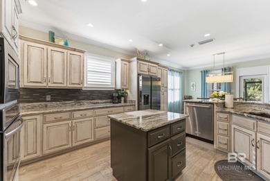 Meticulously maintained home overlooking #3 Lakes fairway and on Peninsula Golf and Racquet Club in Alabama - for sale on GolfHomes.com, golf home, golf lot