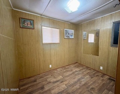 Check out this 2 bedroom, 1 bath home nestled in the tall pines on Bison Golf and Country Club in Arizona - for sale on GolfHomes.com, golf home, golf lot