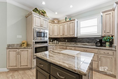 Meticulously maintained home overlooking #3 Lakes fairway and on Peninsula Golf and Racquet Club in Alabama - for sale on GolfHomes.com, golf home, golf lot