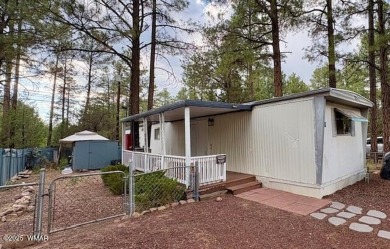 Check out this 2 bedroom, 1 bath home nestled in the tall pines on Bison Golf and Country Club in Arizona - for sale on GolfHomes.com, golf home, golf lot