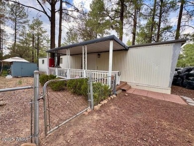 Check out this 2 bedroom, 1 bath home nestled in the tall pines on Bison Golf and Country Club in Arizona - for sale on GolfHomes.com, golf home, golf lot