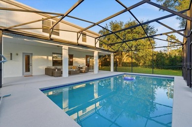 Picture mornings by your sparkling pool, coffee in hand on Wedgefield Golf Club in Florida - for sale on GolfHomes.com, golf home, golf lot