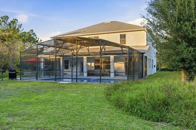 Picture mornings by your sparkling pool, coffee in hand on Wedgefield Golf Club in Florida - for sale on GolfHomes.com, golf home, golf lot