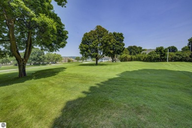 Tucked within the highly sought-after Harborage Park community on Ye Nyne Olde Holles Golf Club in Michigan - for sale on GolfHomes.com, golf home, golf lot