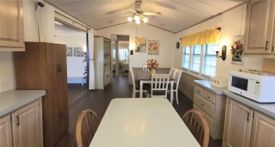 CHEERFUL HOME IN ACTIVE 55+ COMMUNITY! This one bed, two bath on River Run Golf Links in Florida - for sale on GolfHomes.com, golf home, golf lot