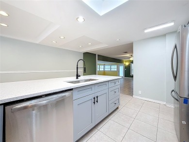 Discover this beautifully renovated 4-bedroom, 2-bathroom home on Temple Terrace Golf and Country Club in Florida - for sale on GolfHomes.com, golf home, golf lot