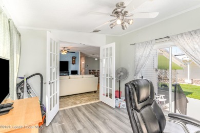 Welcome to your slice of paradise in Barefoot Bay! This charming on Barefoot Bay Golf Course in Florida - for sale on GolfHomes.com, golf home, golf lot