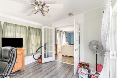 Welcome to your slice of paradise in Barefoot Bay! This charming on Barefoot Bay Golf Course in Florida - for sale on GolfHomes.com, golf home, golf lot