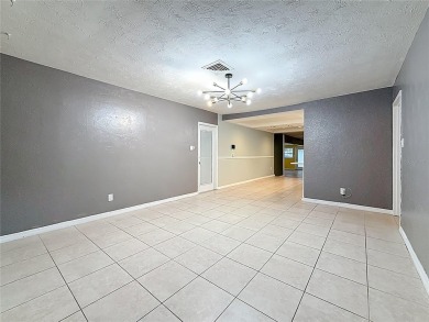Discover this beautifully renovated 4-bedroom, 2-bathroom home on Temple Terrace Golf and Country Club in Florida - for sale on GolfHomes.com, golf home, golf lot